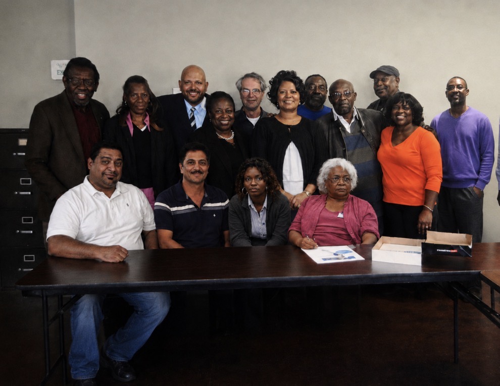 Founding members and early leaders of Charlotte Healthcare Coalition gathered together around a conference table.