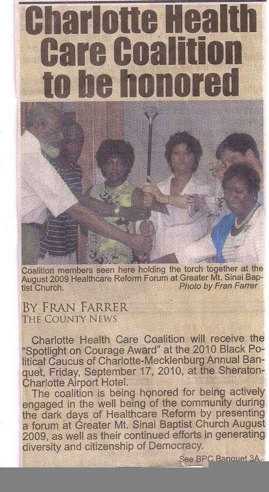 Newspaper clipping headlined 'Charlotte Health Care Coalition to be honored,' showing coalition members holding a torch together at the August 2009 Healthcare Reform Forum at Greater Mt. Sinai Baptist Church.