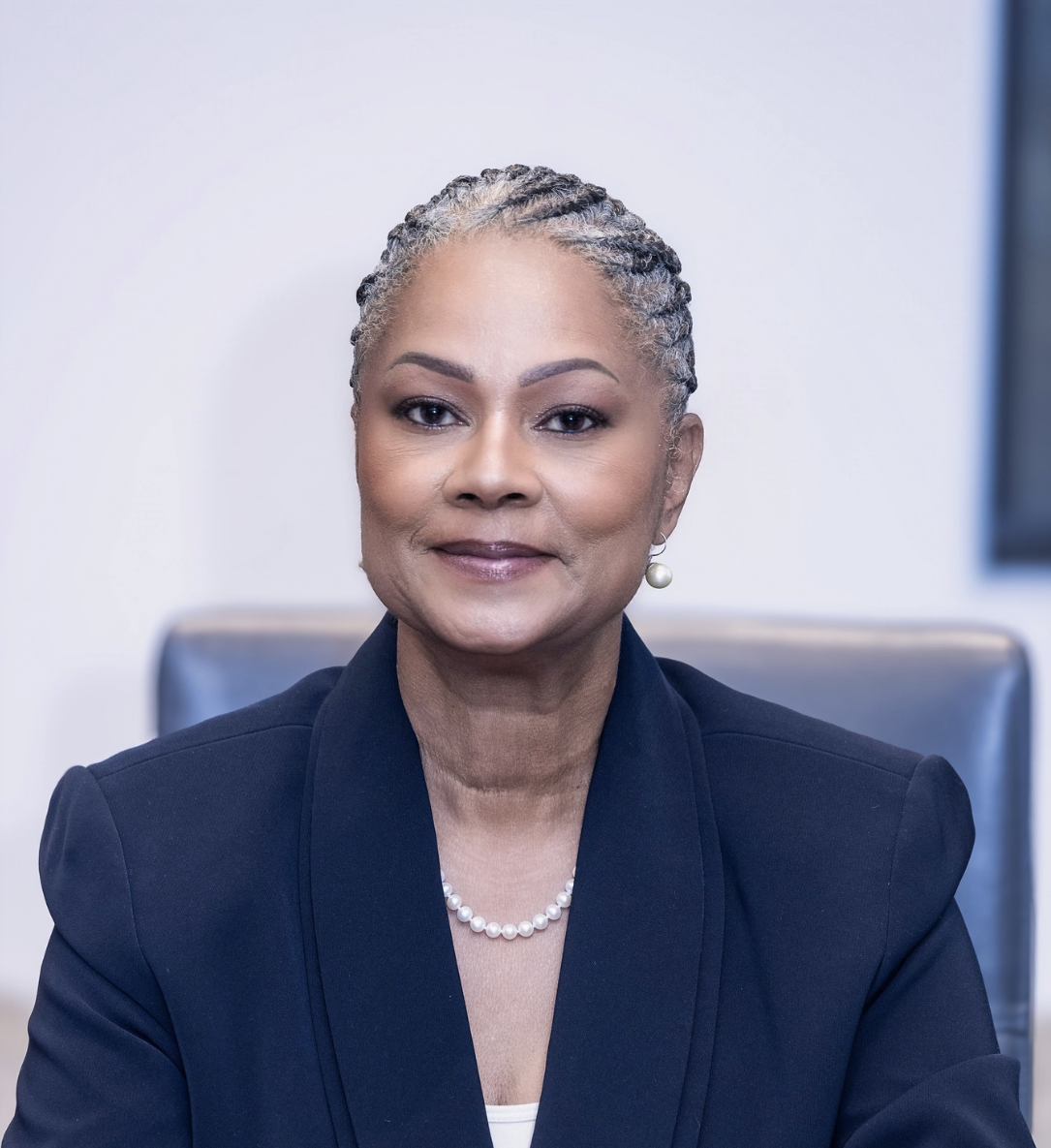 Portrait of CHCC Founder Emeritus Rep. Carla Cunningham wearing a navy blazer and pearl necklace.